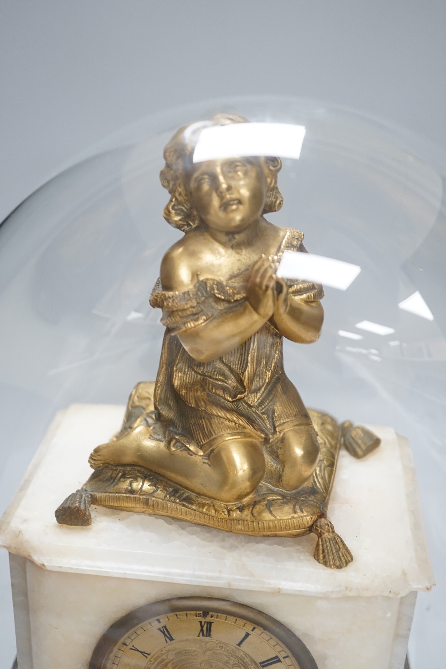 A 19th century ormolu and alabaster mantel clock under glass dome. 39cm tall